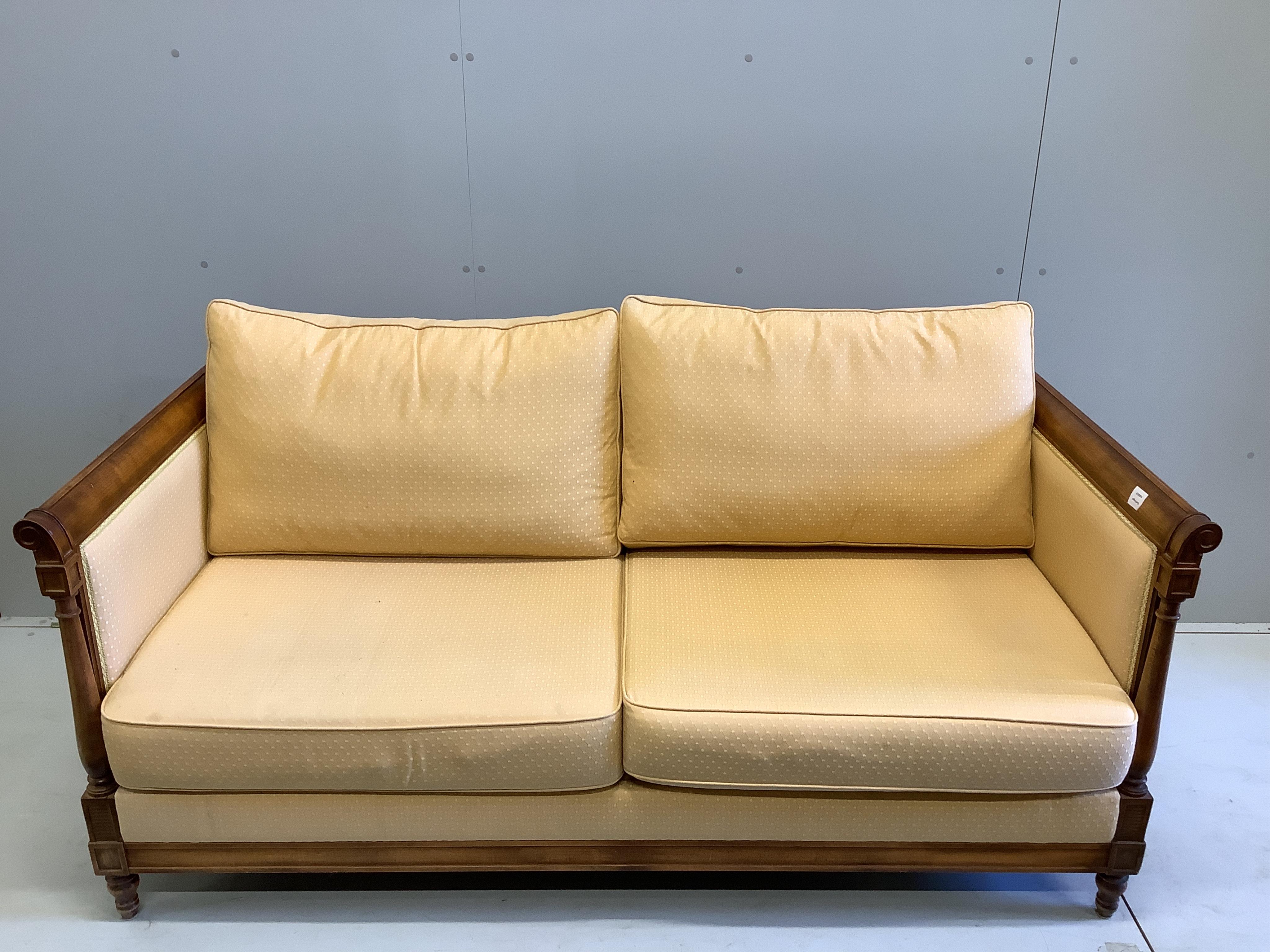 A Wesley-Barrell upholstered beech three seater settee, width 175cm, depth 85cm, height 74cm